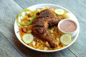 602. CHICKEN MANDI (1/2 CHICKEN GRILLED ON TOP OF MANDI RICE)