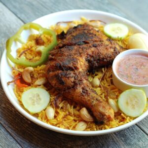 602. CHICKEN MANDI (1/2 CHICKEN GRILLED ON TOP OF MANDI RICE)
